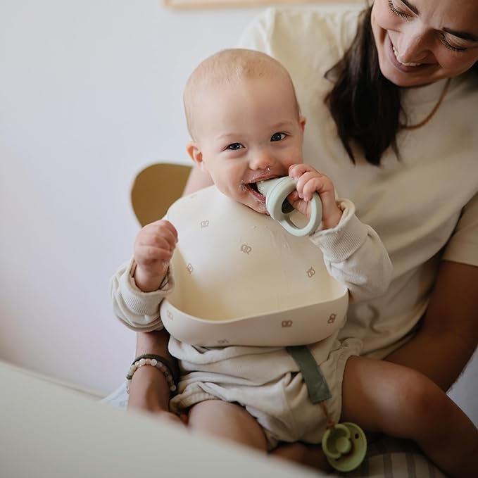 mushie Silicone Baby Bib | Adjustable Fit Waterproof Bibs (Pretzel)-BubblyBeeBaby