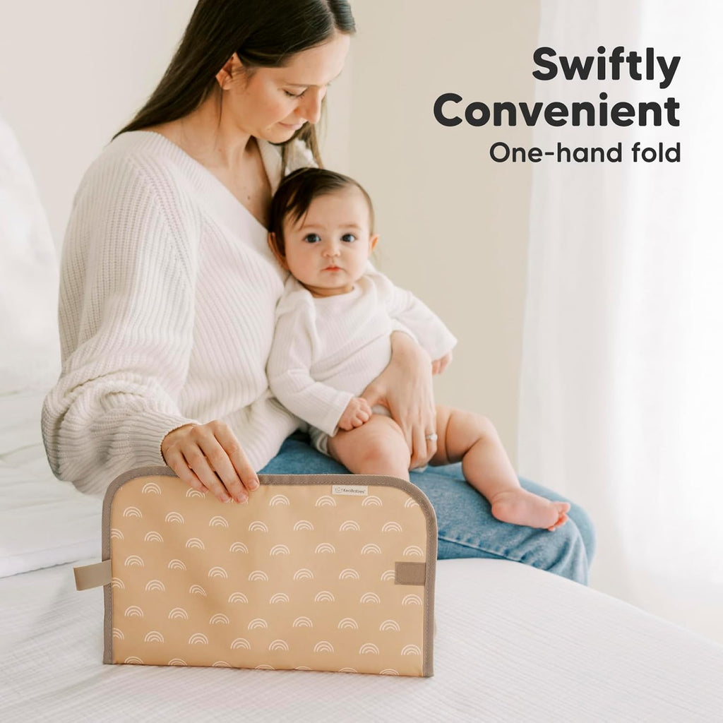 KeaBabies Portable Diaper Changing Pad, Easy Wipe Clean - Foldable Waterproof Baby Changing Mat for Diaper Bag, Compact, Lightweight, 25x13 Baby Changer Travel Essential, Machine Washable (Rainbow)